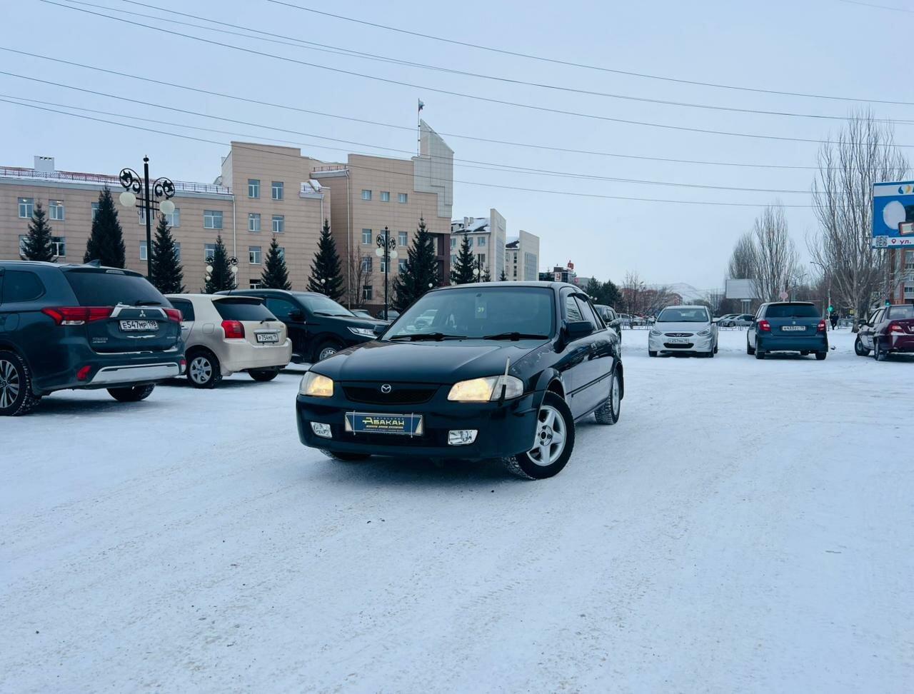 Mazda Familia — фото 1