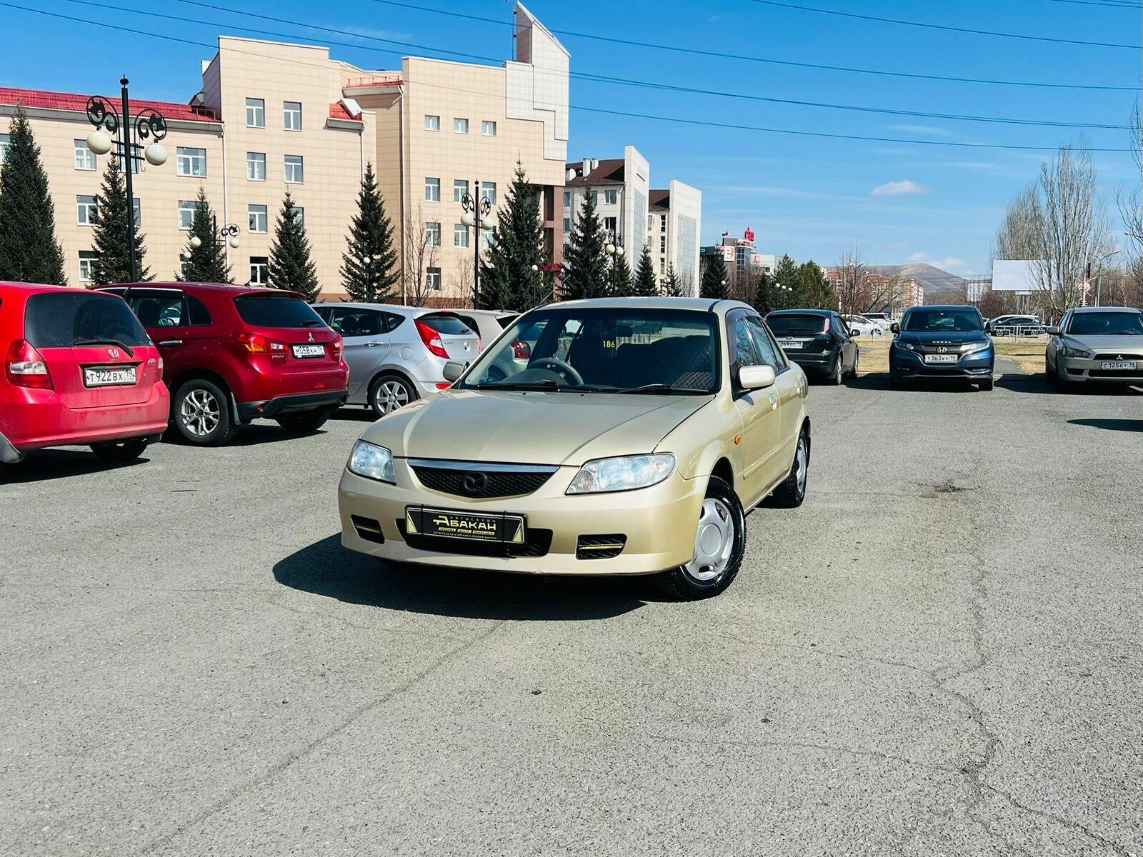Mazda Familia — фото 1